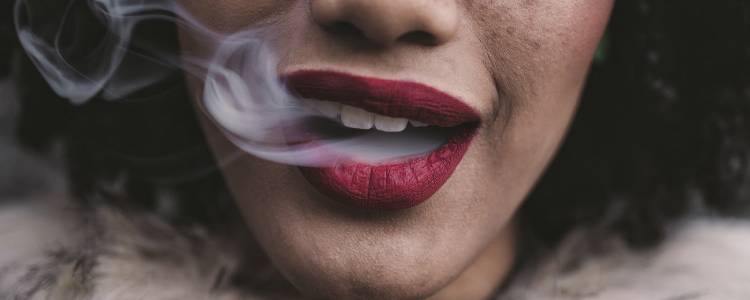Woman smoking cannabis and getting high