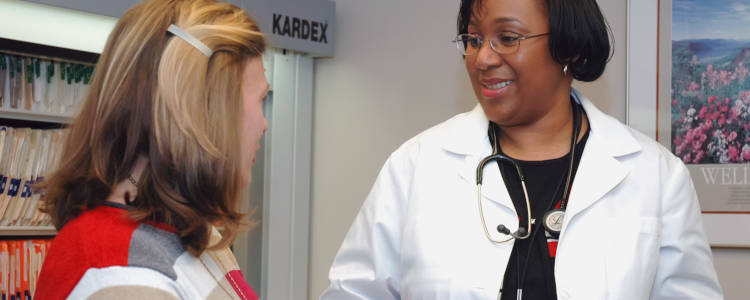 woman speaking with doctor about medication